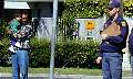 Resigned policeman - wry smiling onlooker
